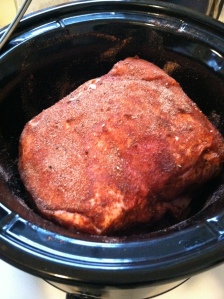 Put a nice spice rub on the pork shoulder (garlic powder, chili powder, cayenne pepper, salt).  We left that rub on for about an hour before we actually put it in the crock pot.